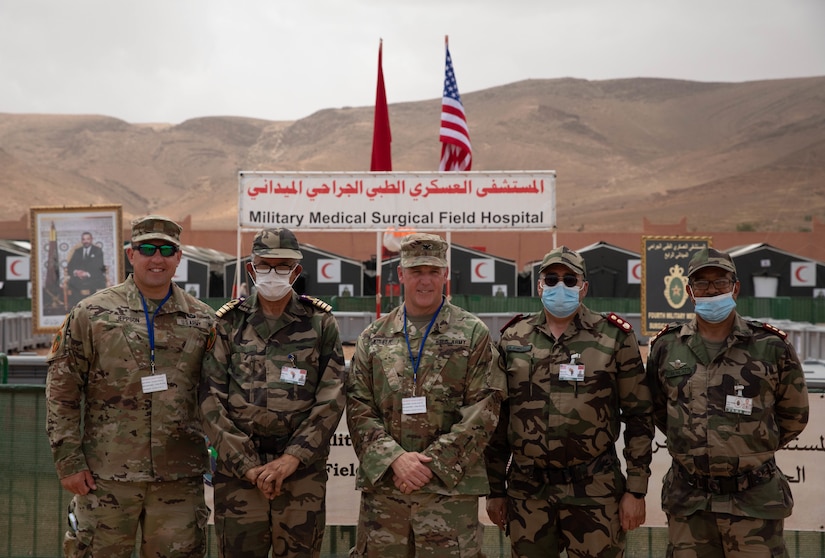 U.S. Army Maj. Joe Jeppson, Col. Tahar Fouad a doctor with the Royal Moroccan Armed Forces , U.S. Army Col. Marcus Wisner, Moroccan Col. Abderrahmane Jemmouj, Col. Saïd Semlali, pause for a photo after an inspection of the Humanitarian Civic Assistance (HCA) center in Taliouine, Morocco June 21, 2022.