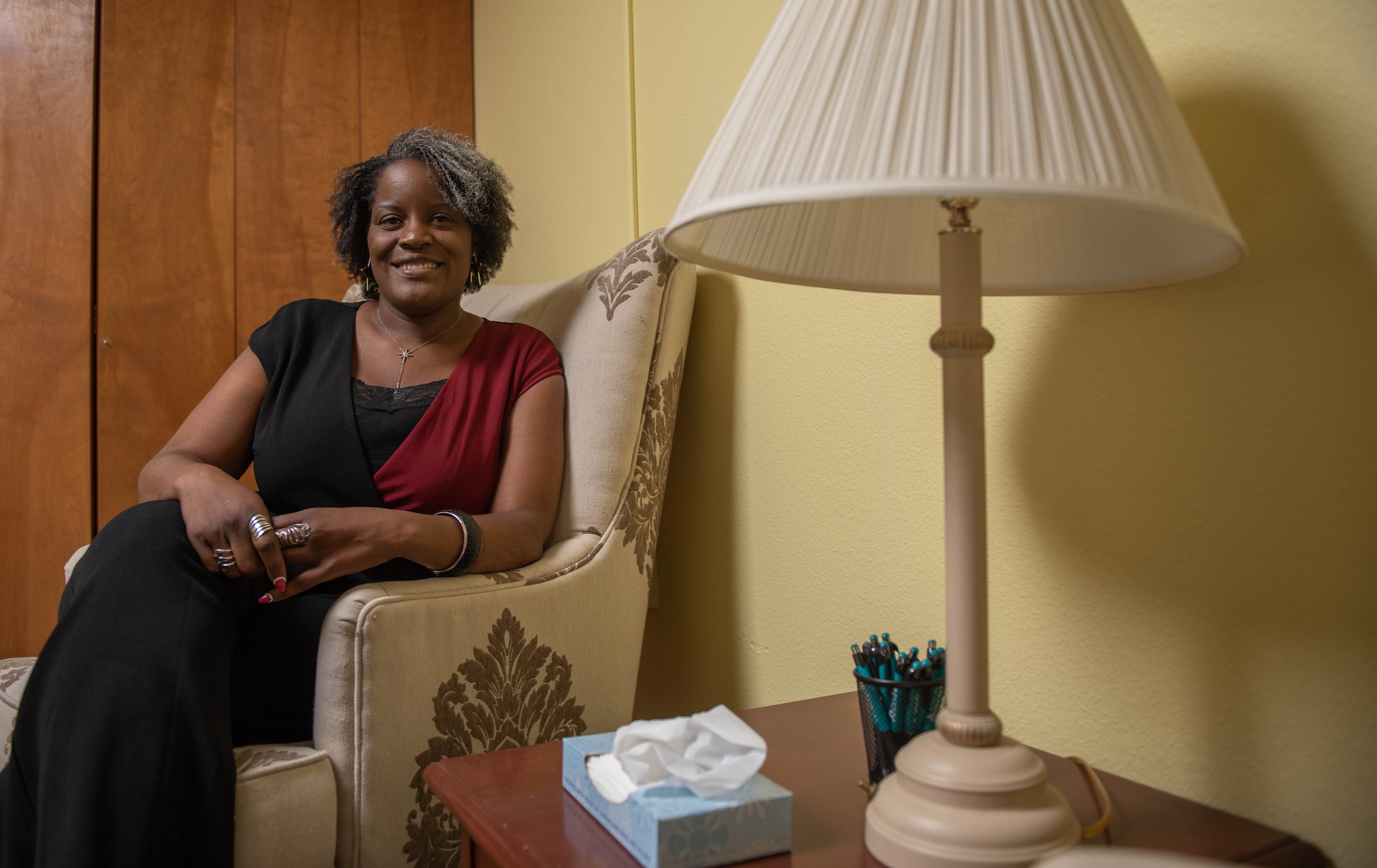 Monroe sits in a lounge area in the SAPR office at Creech Air Force Base, Nevada.