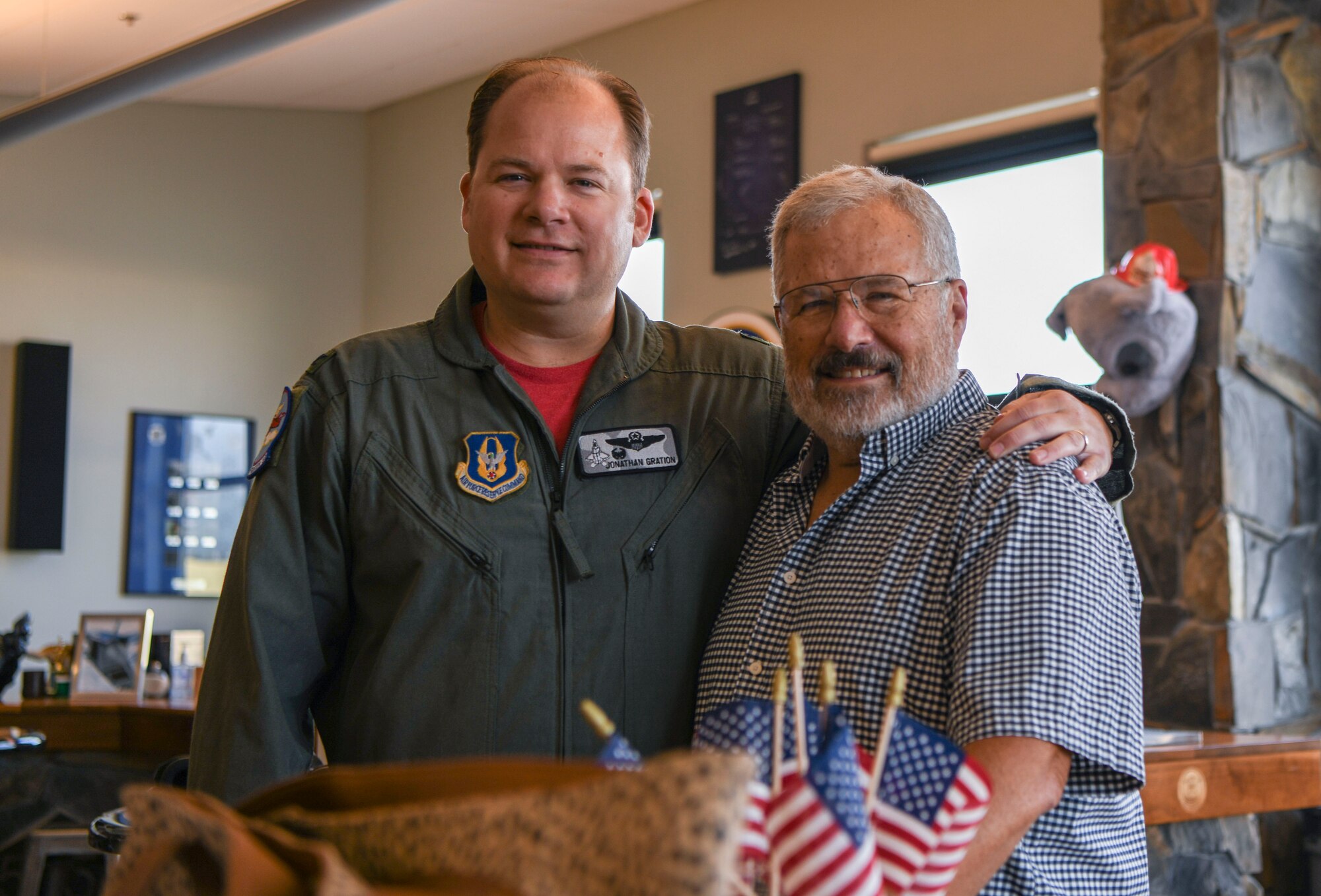 Col. Jonathan Gration Jr., 477th Fighter Group commander and his father Retired Maj. Gen. Jonathan Gration Sr. pose for a photo, June 24, 2022, Joint Base Elmendorf-Richardson, Alaska. Gration Sr. said it was a special moment to be able to salute his son as he taxied out to the runway. (U.S. Air Force photo by Staff Sgt. Melissa Estevez)