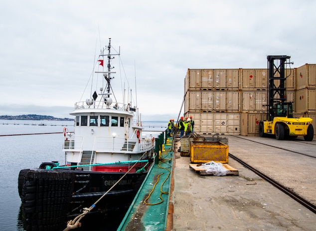 Crews load supplies onto the Naknek Trader during a visit to Naval Magazine Indian Island, Washington March 28, 2022. Indian Island is the U.S. Navy’s only deep-water ammunition port on the West Coast, where the installation can provide conventional ordnance support to vessels ranging from destroyers to submarines and aircraft carriers. (U.S. Navy photo by Mass Communication Specialist 2nd Class Gwendelyn L. Ohrazda)