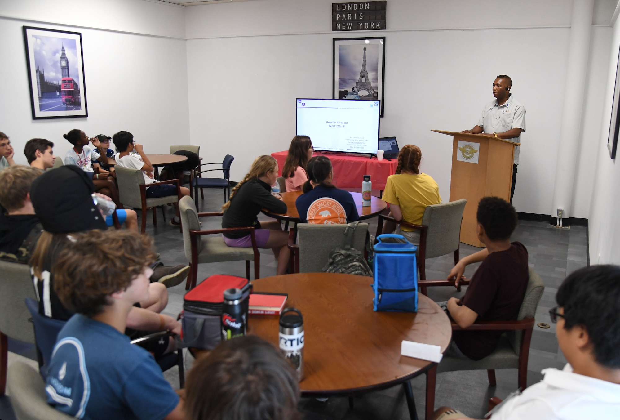 Tyrone Scott, 81st Training Wing historian, discusses the heritage of Keesler Air Force Base and the 81st TRW during a summer camp session inside the Mississippi Aviation Heritage Museum, Gulfport, Mississippi, June 27, 2022. More than 15 school-aged children attended the community outreach event. (U.S. Air Force photo by Kemberly Groue)