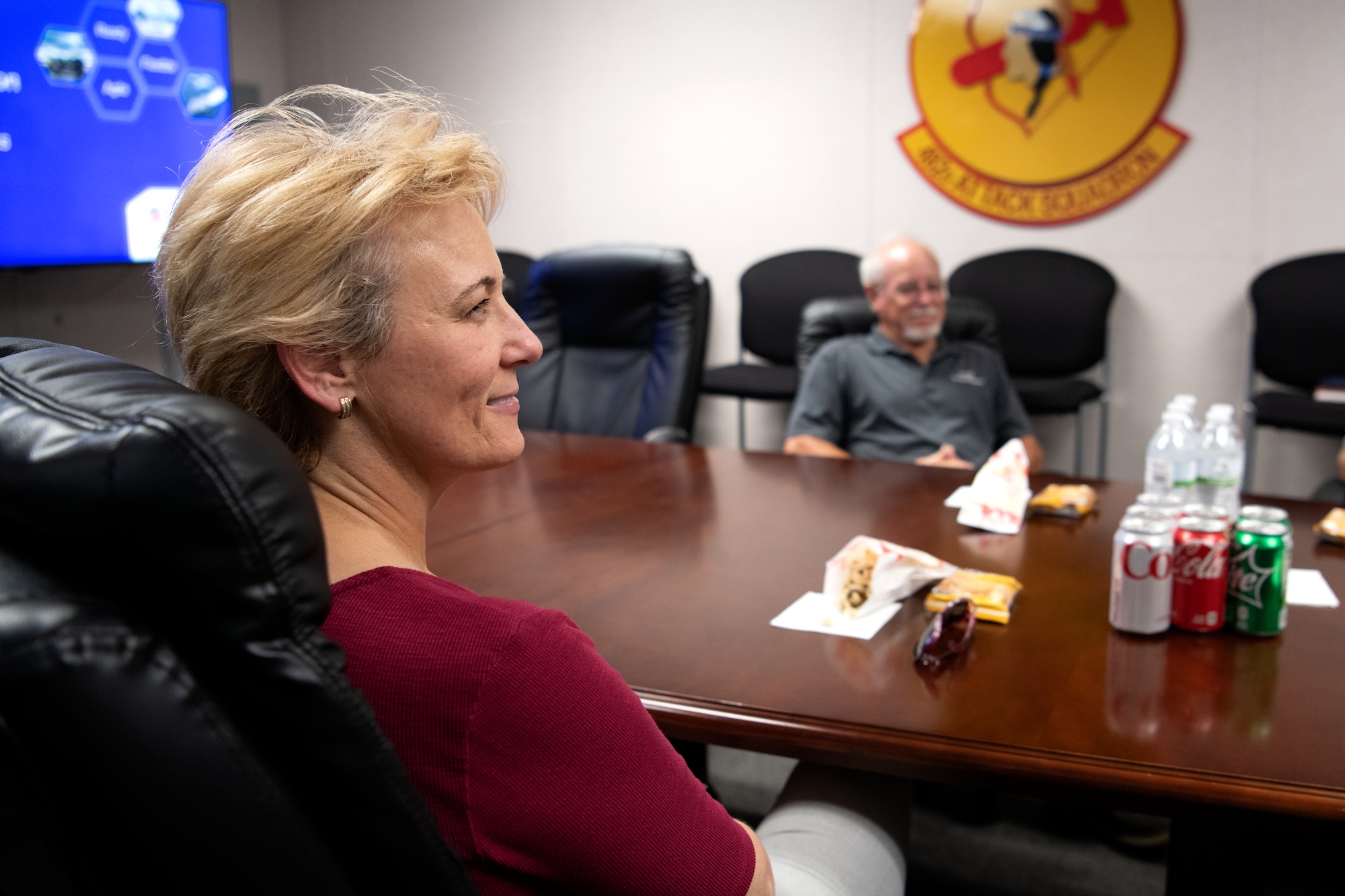 Tina McKiethan, 77th Fighter Generation Squadron honorary commander, listens to a briefing about the 482nd Attack Squadron (ATKS) mission during an immersion tour at Shaw Air Force Base, S.C., June 22, 2022. The tour gave 482nd ATKS Airmen the chance to talk about their job and the history of remotely piloted aircraft in the U.S. Air Force. (U.S. Air Force photo by Staff Sgt. Kelsey Owen)