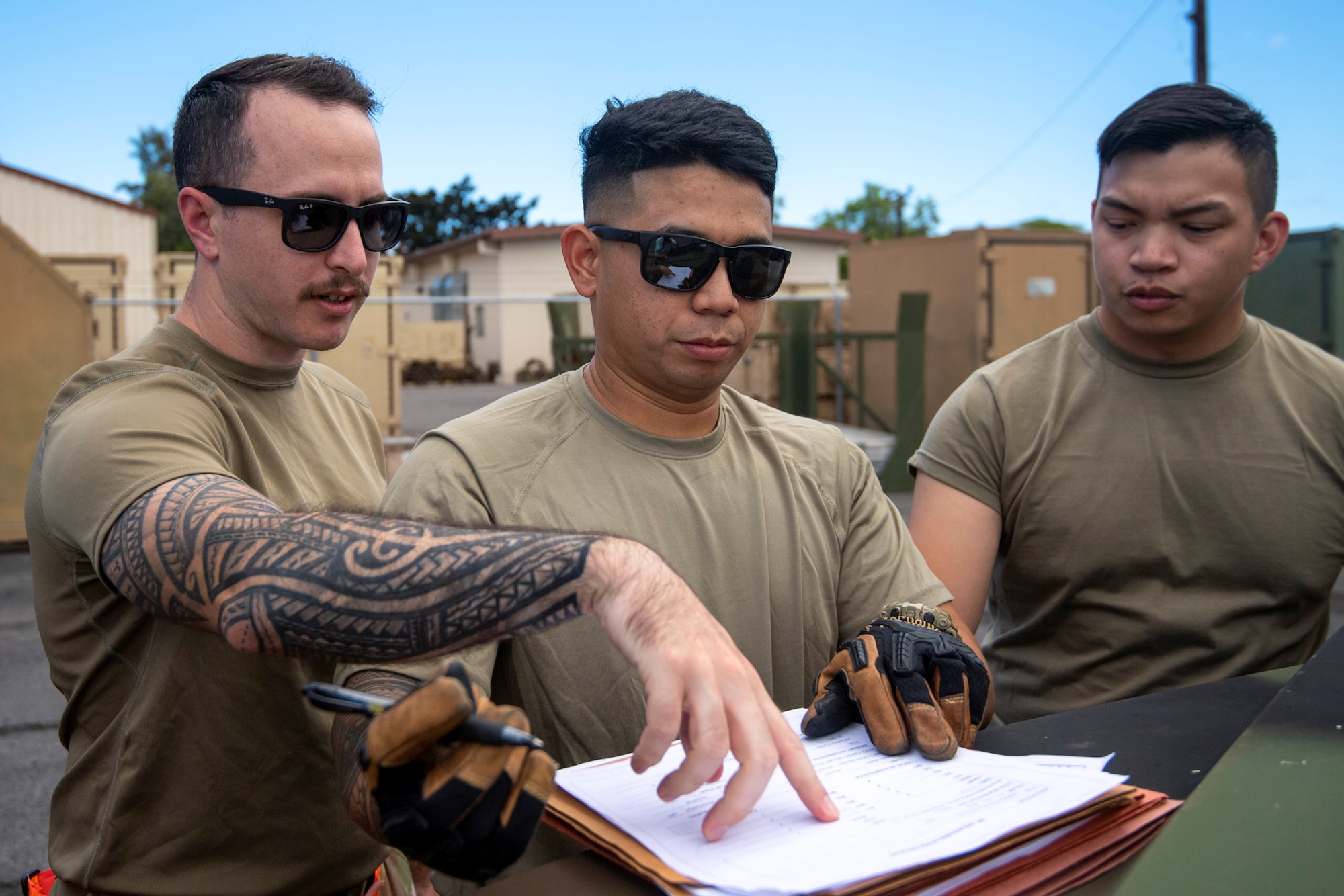 Master Sgt. William Beyer trains airmen from the 48th Aerial Port Squadron on cargo processing paperwork during a Unit Training Assembly, Joint Base Pearl Harbor-Hickam, June 3, 2022.