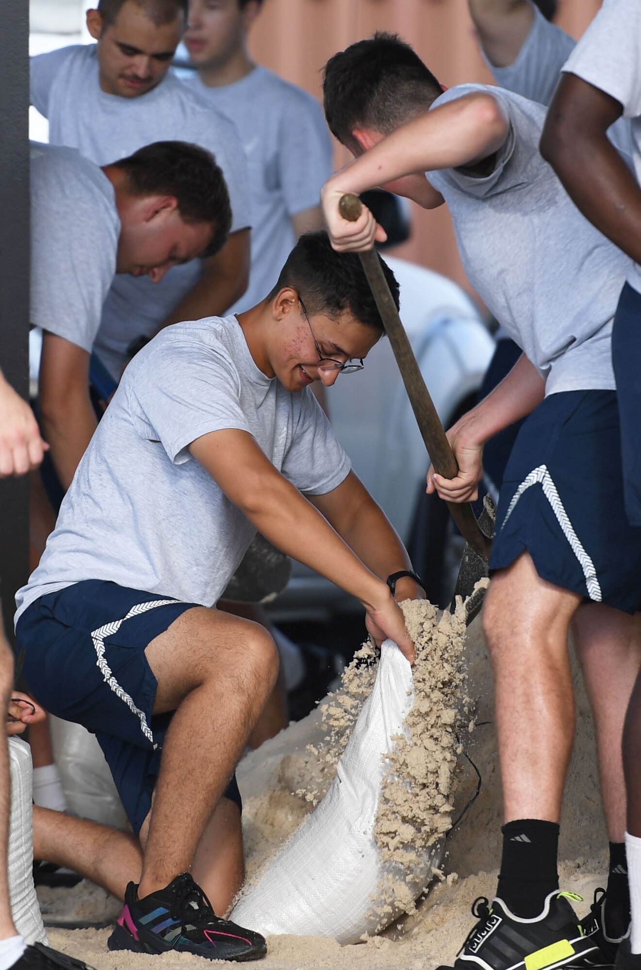 Airmen from the 338th Training Squadron fill sand bags in preparation for the 2022 hurricane season at Keesler Air Force Base, Mississippi, June 27, 2022. Over 40 Airmen assisted the 81st Civil Engineer Squadron with filling more than 2500 sand bags. Hurricane season runs from June 1 through November 30. (U.S. Air Force photo by Kemberly Groue)