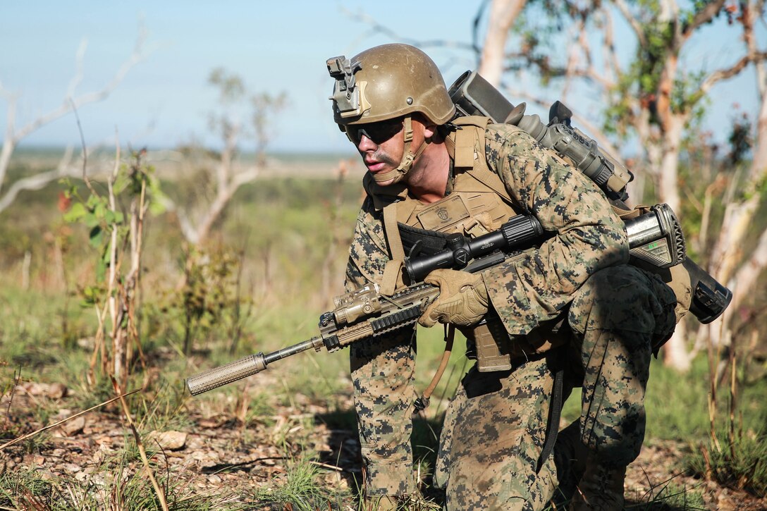 U.S. Marine Corps Lance Cpl. Joseph D. Weinstock, a rifleman with 3d Battalion, 7th Marine Regiment, Ground Combat Element, Marine Rotational Force-Darwin (MRF-D) 22, crawls to a support by fire position during exercise Darrandarra 22 at Mount Bundey Training Area, NT, Australia, June 15, 2022. Exercise Darrandarra 22 increases MRF-D 22’s readiness to respond to realistic crises throughout a range of military operations within the region. (U.S. Marine Corps photo by Cpl. Cameron Hermanet)