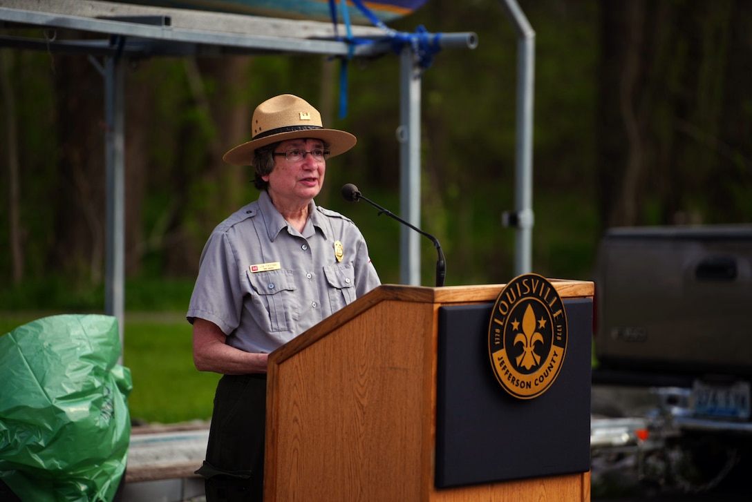 Lisa Freeman, natural resources specialist with the U.S. Army Corps of Engineers Louisville District presents the history and purpose of the Falls of the Ohio National Wildlife Conservation Area during an Earth Day clean-up event at Shawnee Park in Louisville, Kentucky April 22, 2022. USACE, along with numerous organizations celebrated Earth Day by picking up trash and cleaning up the south shore of Shawnee Park and the north shore of the Falls of the Ohio Wildlife Conservation Area. (U.S. Army Corps of Engineers photo by Charles Delano)