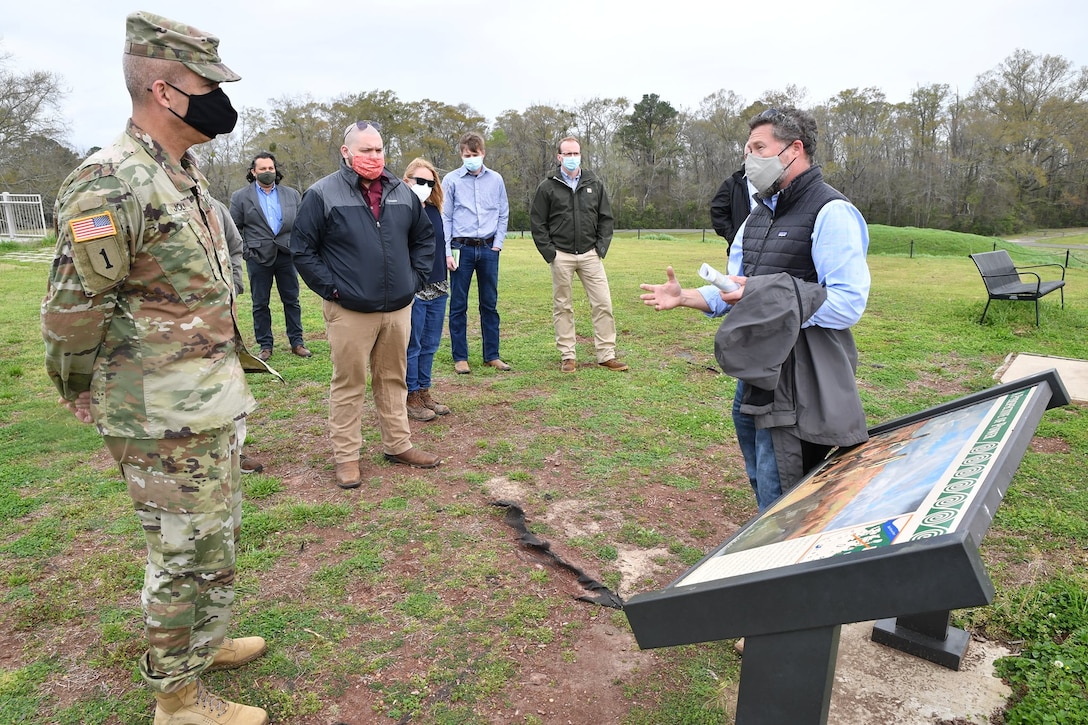 A tour guide at the Moundville Archaeological Park describes the history of the park and its importance to Native Americans and their history on of the mounds in Moundville, Alabama on March 23, 2021. The Mobile District recently repaired the shoreline at the park, one of many projects on Native American lands across the country that USACE completes each year.