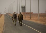 U.S. Army Soldiers assigned to the 19th Special Forces Group (Airborne), Utah Army National Guard, walk towards the airfield in Grier Labouihi, Morocco, to conduct a combined airborne operation with Royal Moroccan Army soldiers and Tunisian Land Army paratroopers during African Lion 22, June 19, 2022.
