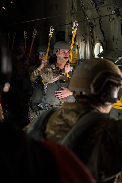 U.S. Army Soldiers assigned to the 19th Special Forces Group (Airborne), Utah Army National Guard, stand ready to jump out of a C-130 during a friendship airborne operation in Grier Labouihi, Morocco, during African Lion 22, June 19, 2022.