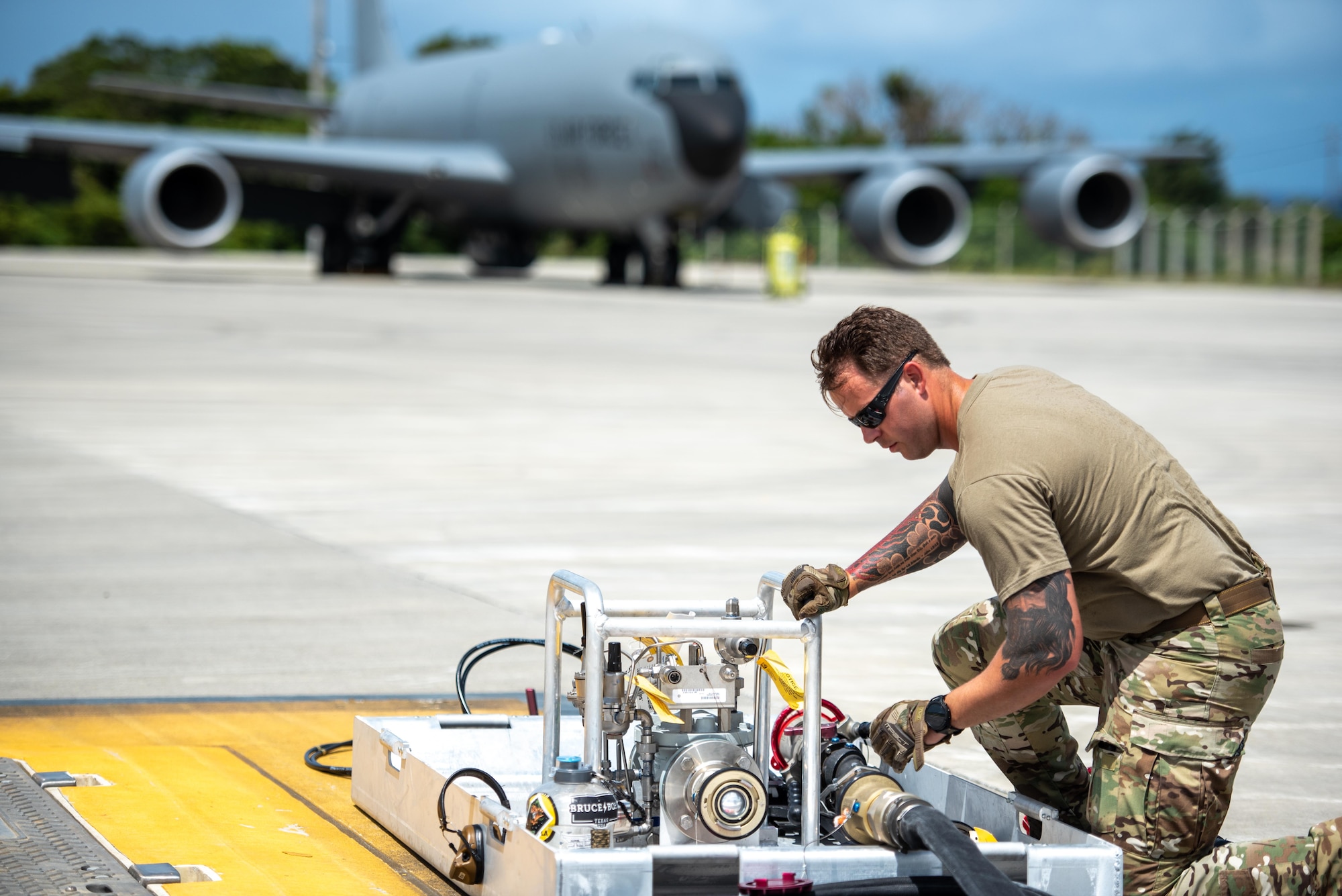Airmen preparing a refueling kit prior to refueling an aircraft