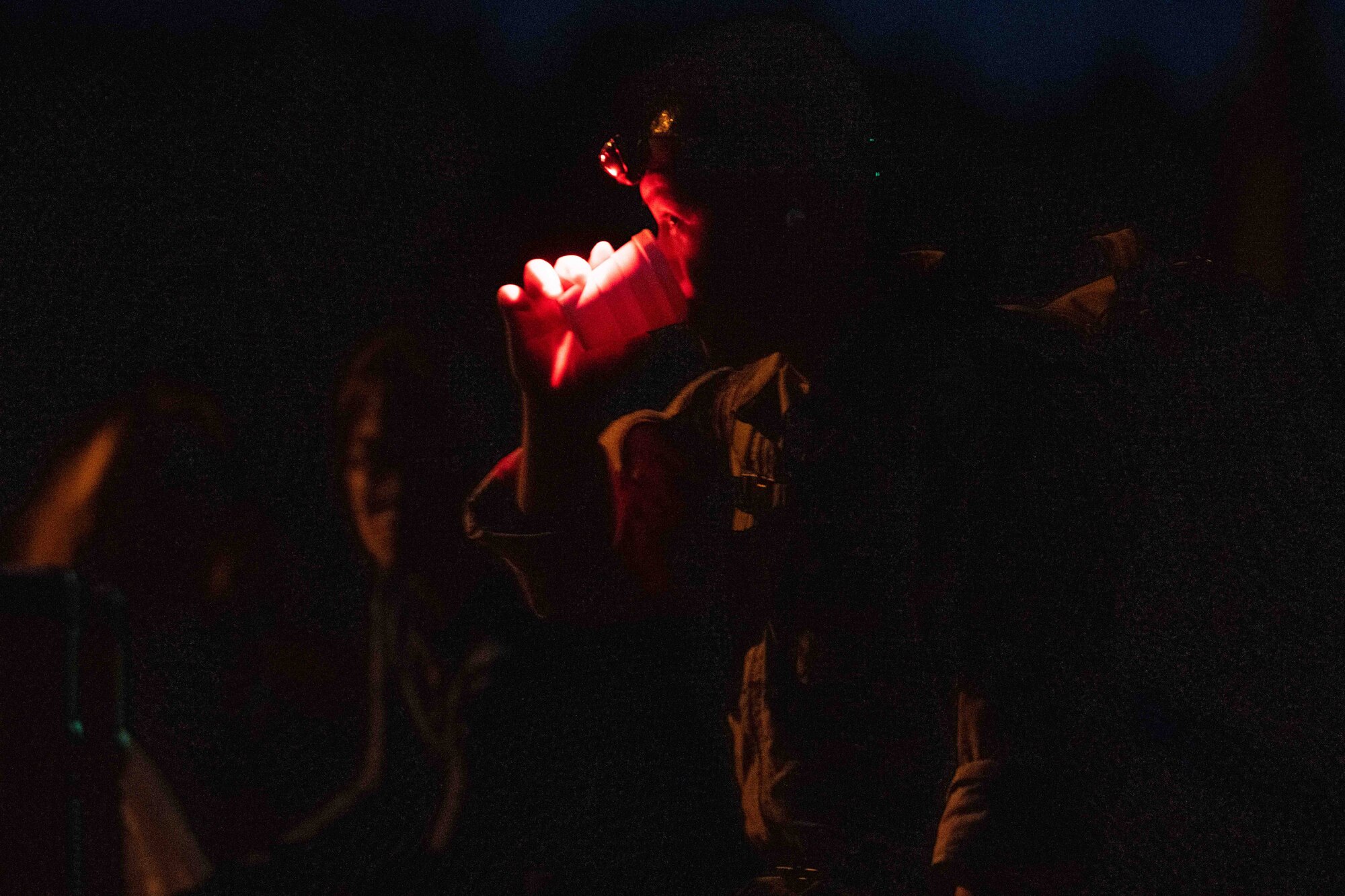 A member of Team Misawa drinks water at a checkpoint during a Norwegian Foot March at Misawa Air Base, Japan, June 25, 2022.