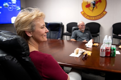 Tina McKiethan, 77th Fighter Generation Squadron honorary commander, listens to a briefing about the 482nd Attack Squadron (ATKS) mission during an immersion tour at Shaw Air Force Base, S.C., June 22, 2022. The tour gave 482nd ATKS Airmen the chance to talk about their job and the history of remotely piloted aircraft in the U.S. Air Force. (U.S. Air Force photo by Staff Sgt. Kelsey Owen)