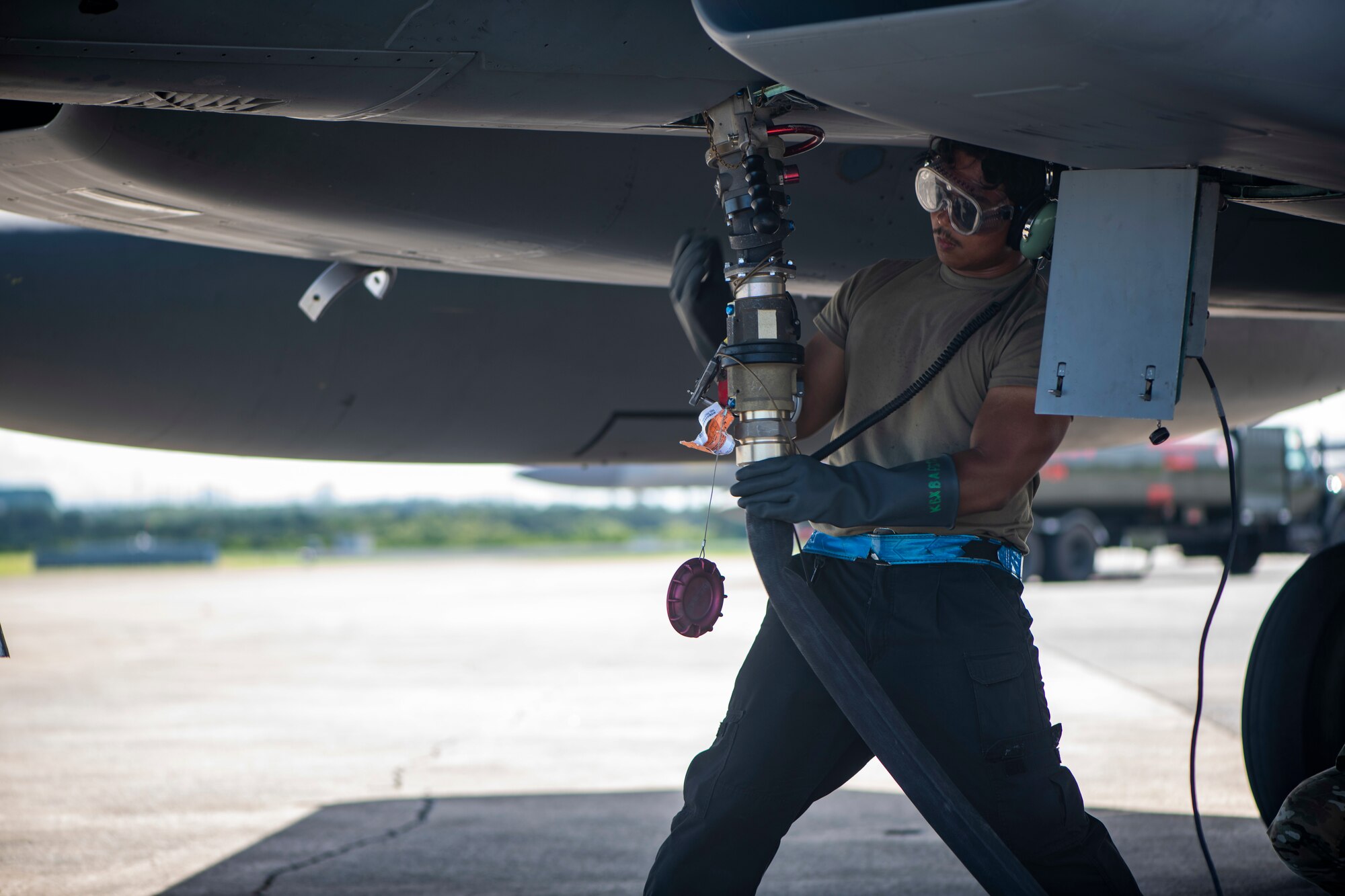 44th Aircraft Maintenance Unit dedicated crew chief, refuels a F-15C Eagle during hot pit refueling