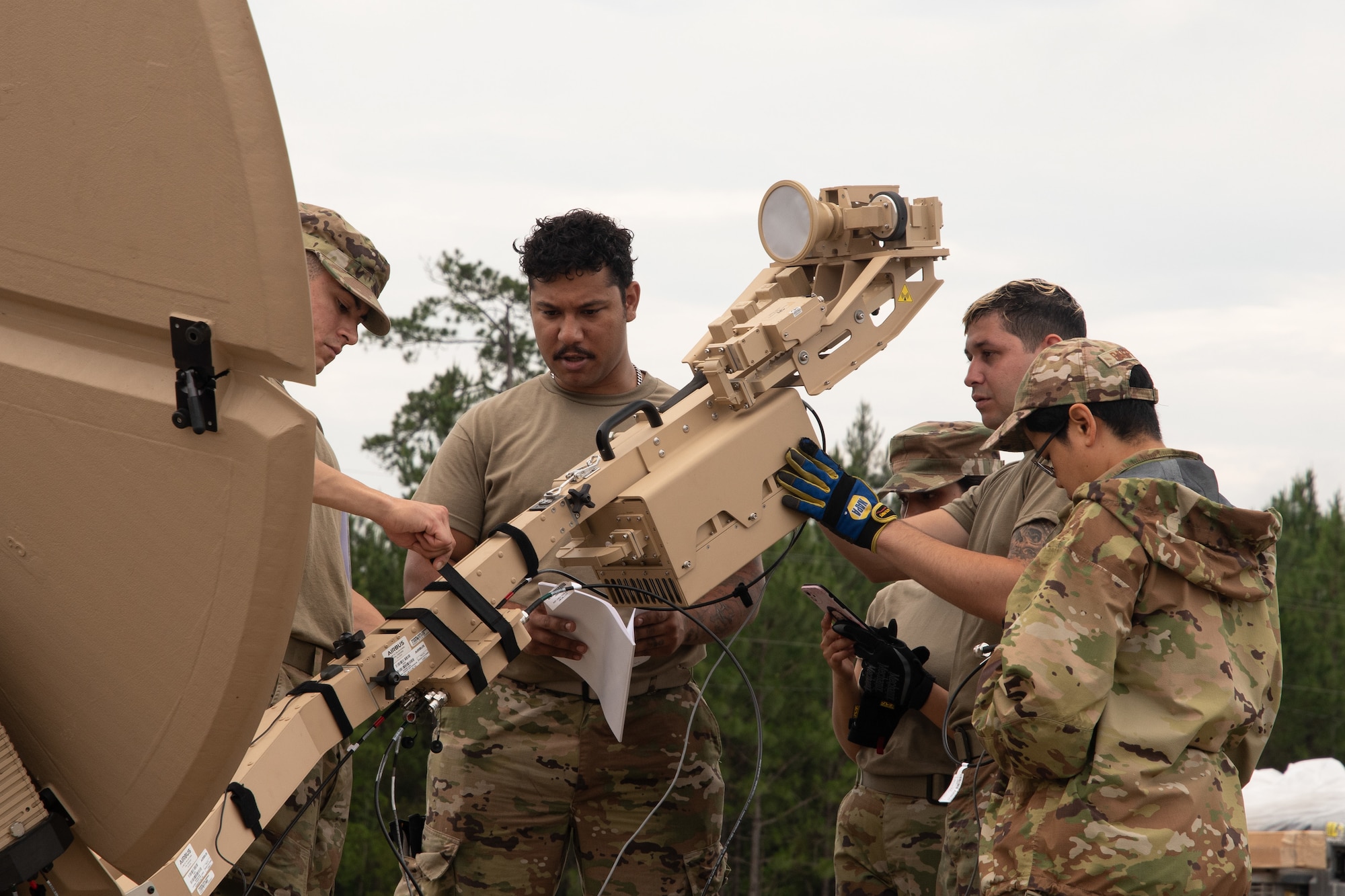 Members of the 147th Combat Communications Squadron ready a satellite communications terminal for use during Exercise BUMBU 22 at Camp Shelby, Miss., June 3, 2022. BUMBU 22 brings five combat communications squadrons with the 254th Combat Communications Group from their home stations located across the nation together for a consolidated training exercise. (U.S. Air National Guard photo by Staff Sgt. Adrian Brakeley)