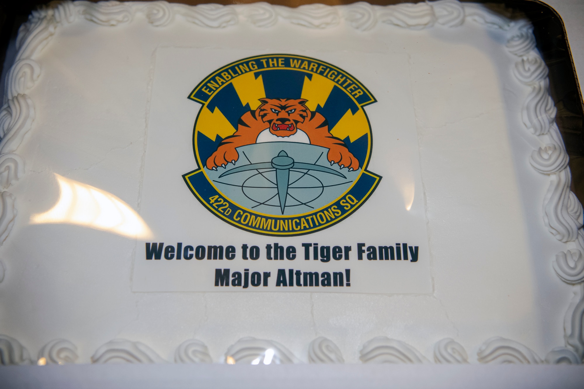 A cake welcoming Maj. Amanda Altman, 422d Communications Squadron incoming commander, rests on a table prior to an assumption of command ceremony at RAF Croughton, England, June 27, 2022. Altman completed an Air University Fellowship at Maxwell Air Force Base, Alabama, prior to assuming command of the 422d CS. (U.S. Air Force photo by Staff Sgt. Eugene Oliver)