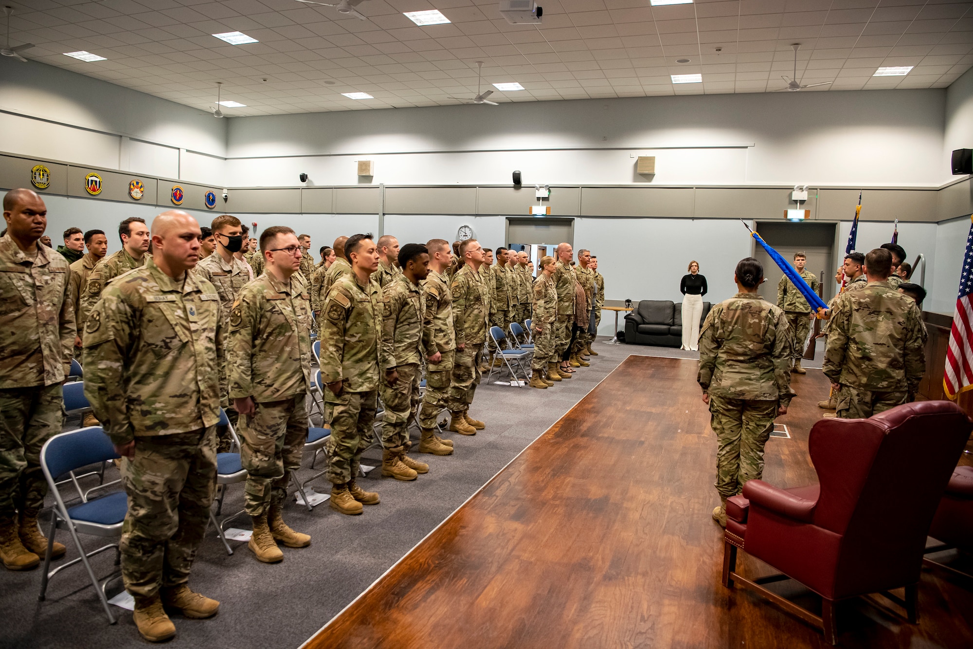 Airmen and Guardians from the 501st Combat Support Wing, stand at attention during an assumption of command ceremony at RAF Croughton, England, June 27, 2022. An assumption of command is a military tradition that represents the formal gaining of a unit’s authority and responsibility by a commander. (U.S. Air Force photo by Staff Sgt. Eugene Oliver)