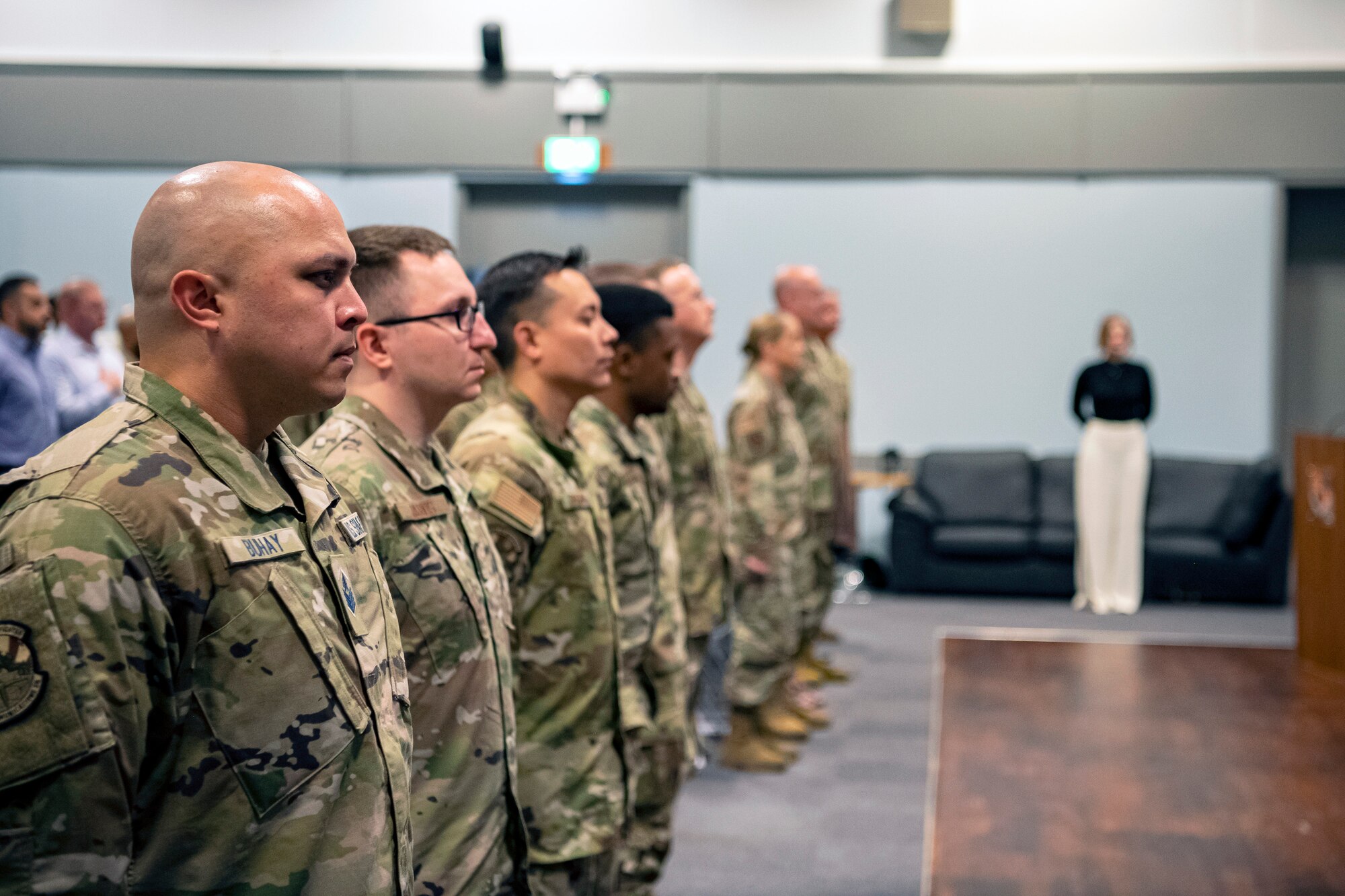 Airmen and Guardians from the 501st Combat Support Wing, stand at attention during an assumption of command ceremony at RAF Croughton, England, June 27, 2022. An assumption of command is a military tradition that represents the formal gaining of a unit’s authority and responsibility by a commander. (U.S. Air Force photo by Staff Sgt. Eugene Oliver)