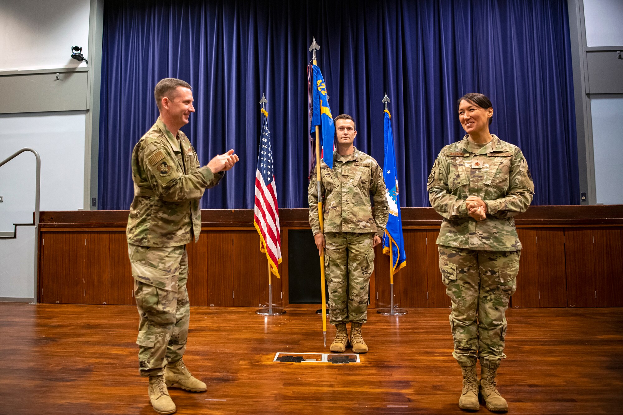 U.S. Air Force Col. Jon T. Hannah, 422d Air Base Group commander, gives a round of applause to Maj. Amanda Altman, 422d Communications Squadron incoming commander, during an assumption of command ceremony at RAF Croughton, England, June 27, 2022. An assumption of command is a military tradition that represents the formal gaining of a unit’s authority and responsibility by a commander. (U.S. Air Force photo by Staff Sgt. Eugene Oliver).
