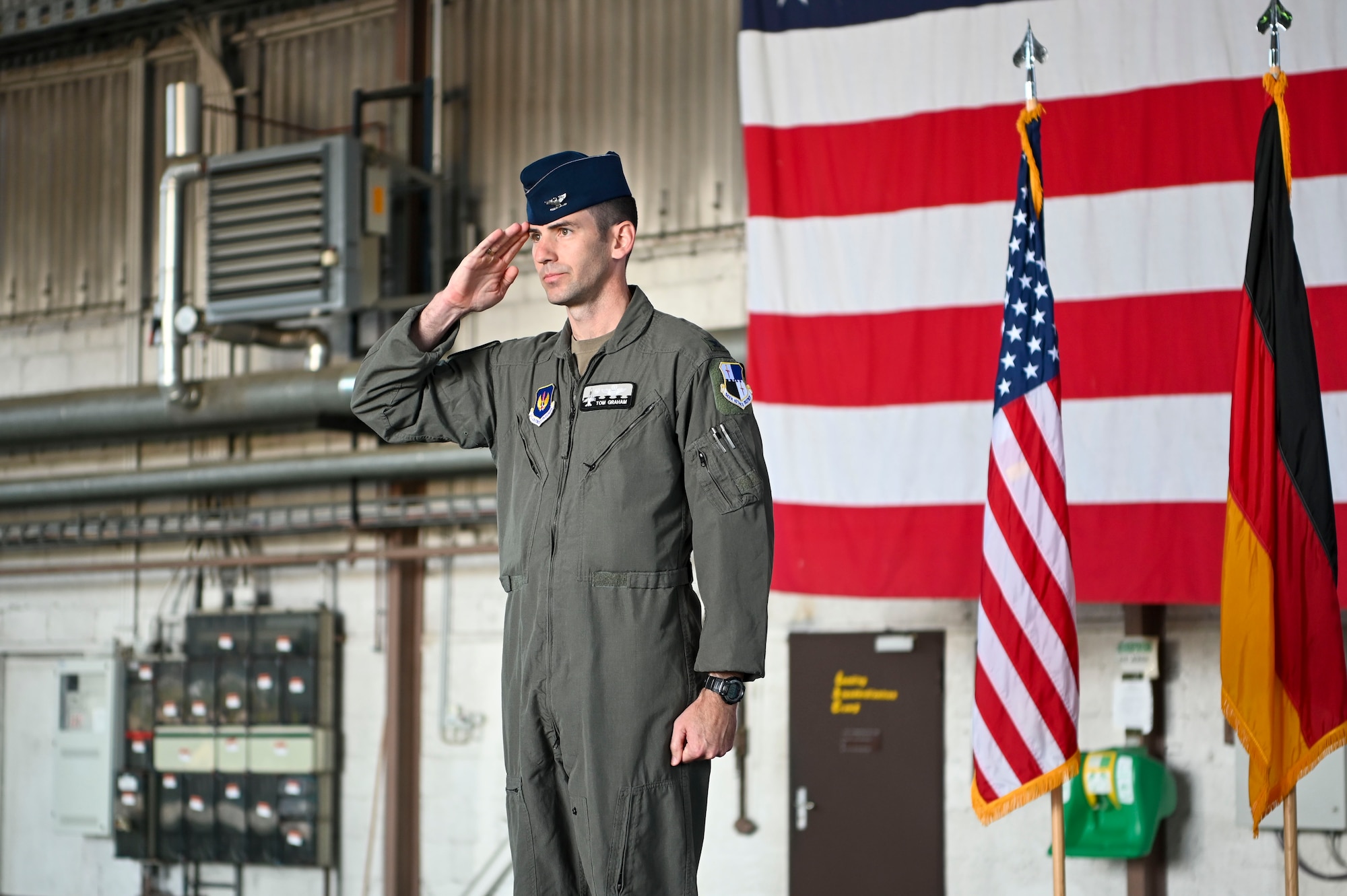 Col. Thomas Graham, 52nd Operations Group commander, renders the first salute during the 52nd OG assumption of command ceremony, June 28, 2022, on Spangdahlem Air Base, Germany. The first salute is a customary sign of respect and responsibility between members of the unit and the commander. (U.S. Air Force photo by Senior Airman Jessica Sanchez-Chen)