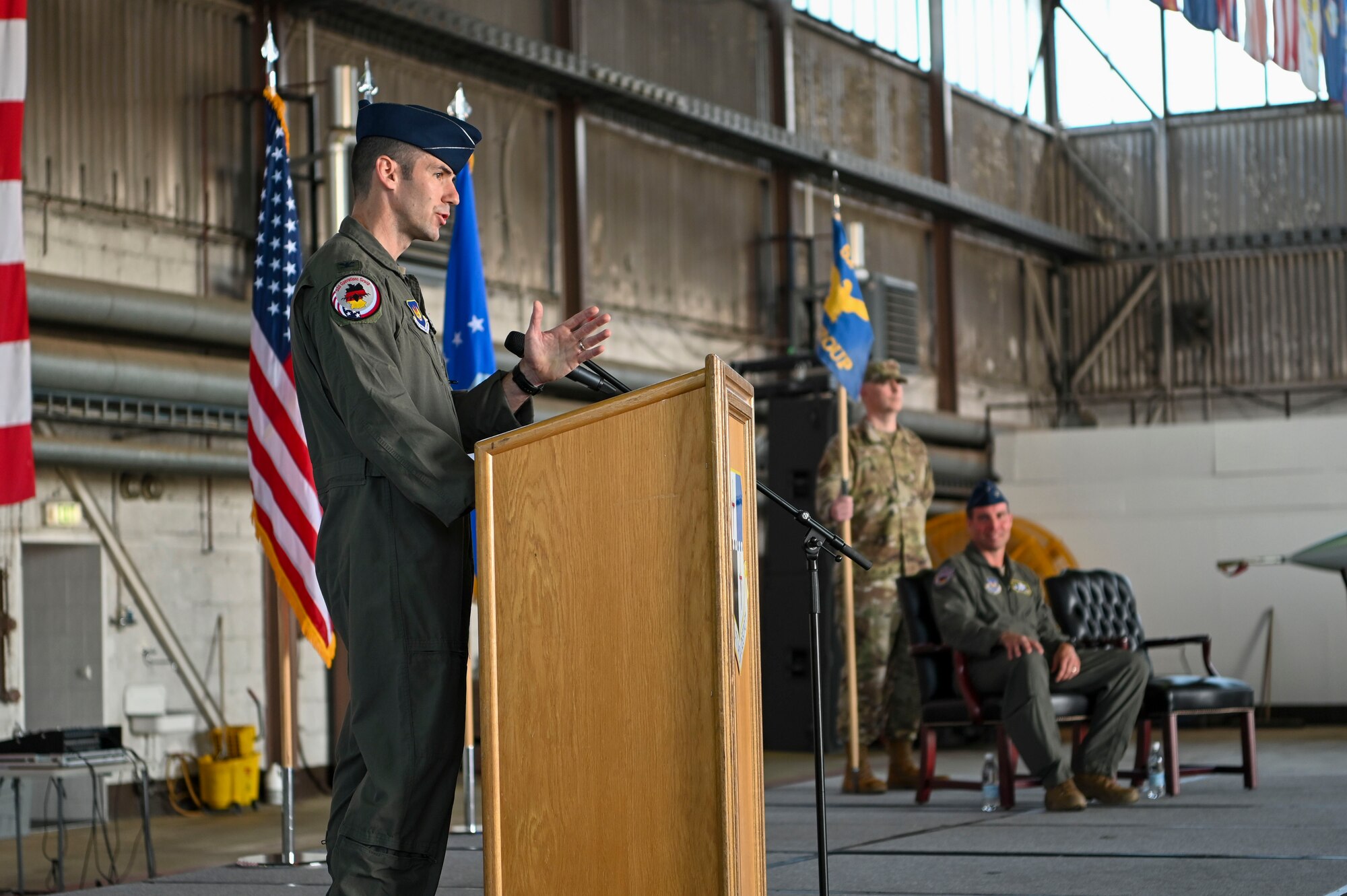 Col. Thomas Graham, 52nd Operations Group commander gives his first speech during his assumption of command, June 28, 2022, on Spangdahlem Air Base, Germany. Graham was previously the Assistant Air Attaché at the U.S. Embassy, London, United Kingdom, before assuming his new role. (U.S. Air Force photo by Senior Airman Jessica Sanchez-Chen)