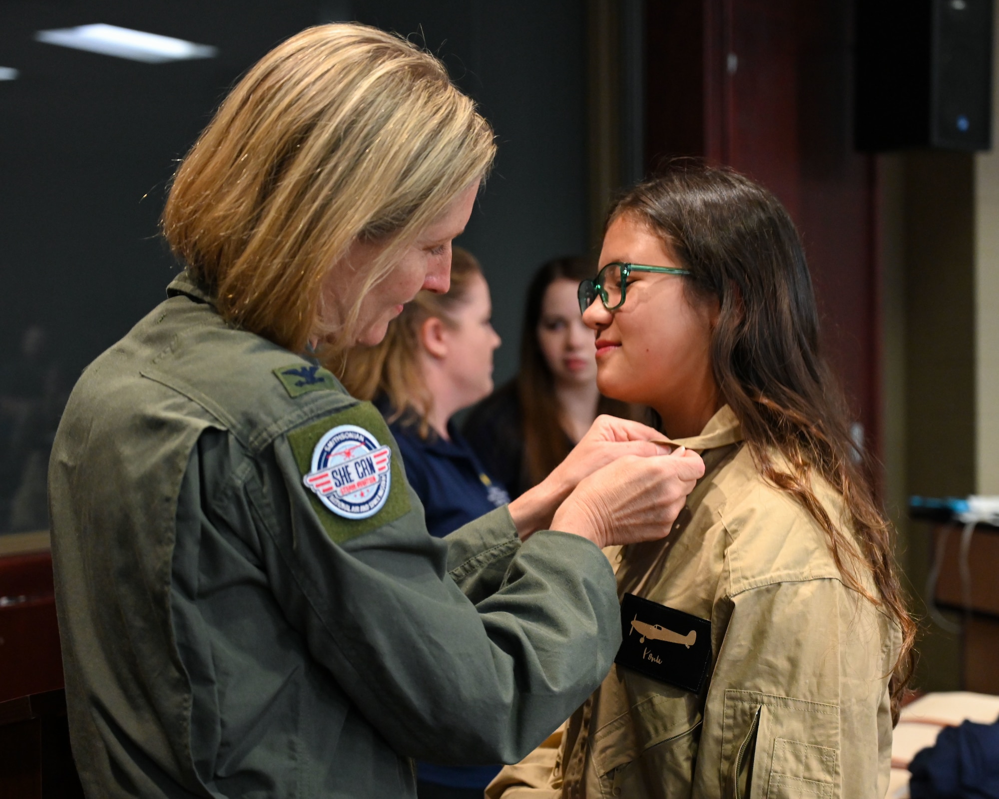 Col. Angela Ochoa pins wings on a student.