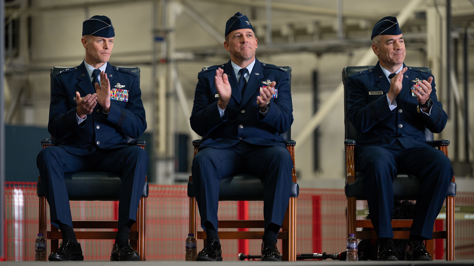 Photo of three Airmen sitting