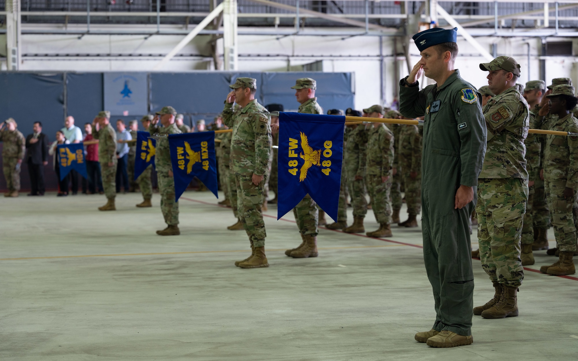 Photo of Airmen saluting