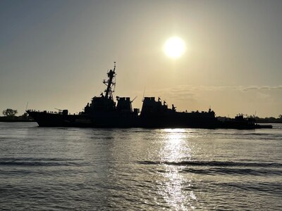 220422-N-WW980-018 NEW ORLEANS, (April 22, 2022) - USS Lassen heads down the Mississippi River back out toward the Gulf of Mexico.  The ship's departure from the "Big Easy" signaled the end of Navy Week New Orleans. The USS Lassen is headed next for Fleet Week Port Everglades in Fort Lauderdale, Florida beginning May 1.  Fleet Weeks are designed to show Americans the investment they have made in their Navy and increase the awareness of the Navy’s role and purpose in our national defense. (U.S. Navy photo by Jay Cope/Released)