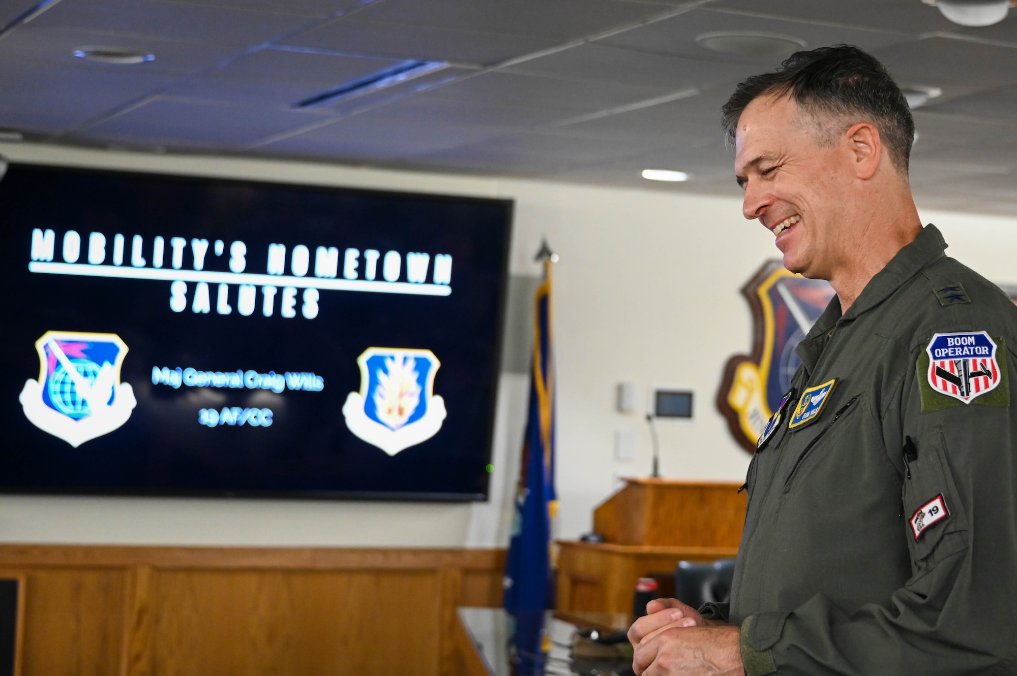 U.S. Air Force Maj. Gen. Craig D. Wills, 19th Air Force (AF) commander, smiles as group commanders say their final farewells to him at Altus Air Force Base, Oklahoma, June 23, 2022. This is Wills’ last visit to the “Mighty 97th” as the 19th AF commander due to his retirement in August 2022. (U.S. Air Force photo by Senior Airman Kayla Christenson)