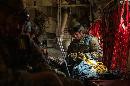 A U.S. Army Soldier assigned to the 19th Special Forces Group (Airborne), Utah Army National Guard, counts the number of static lines after his jumpers, known as a stick, successfully jumped out of a Moroccan C-130 in Grier Labouihi, Morocco, during African Lion 22, June 19, 2022.