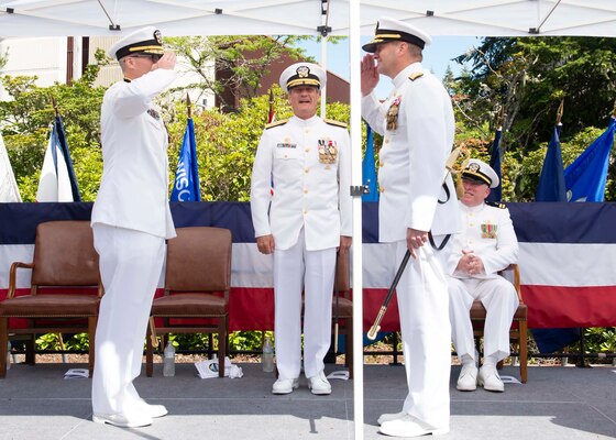 Rear Adm. Robert Gaucher and Rear Adm. Mark Behning salute during a change of command ceremony onboard Naval Base Kitsap – Bangor, Wash., June 28, 2022.