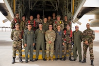 U.S. Army Maj. Gen. Andrew M. Rohling, commander of Southern European Task Force, Africa, accompanied by Soldiers assigned to the 19th Special Forces Group (Airborne), Utah Army National Guard, and Royal Moroccan Army soldiers stand at the back of a Moroccan C-130 for a group photo during the friendship airborne operation in Grier Labouihi, Morocco, as part of African Lion 22, June 19, 2022.