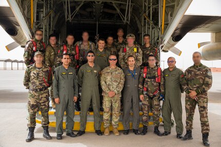 U.S. Army Maj. Gen. Andrew M. Rohling, commander of Southern European Task Force, Africa, accompanied by Soldiers assigned to the 19th Special Forces Group (Airborne), Utah Army National Guard, and Royal Moroccan Army soldiers stand at the back of a Moroccan C-130 for a group photo during the friendship airborne operation in Grier Labouihi, Morocco, as part of African Lion 22, June 19, 2022.