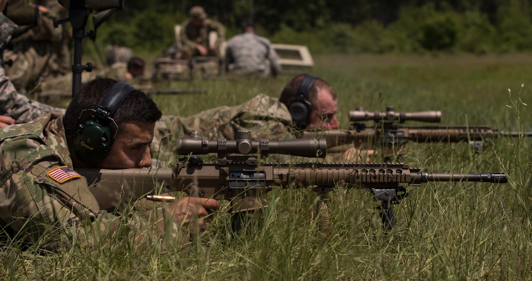 Snipers with the 33rd Infantry Brigade Combat Team, Illinois Army National Guard, hone their skills at a long-distance rifle range at Fort McCoy, Wisconsin, June 9, 2017.