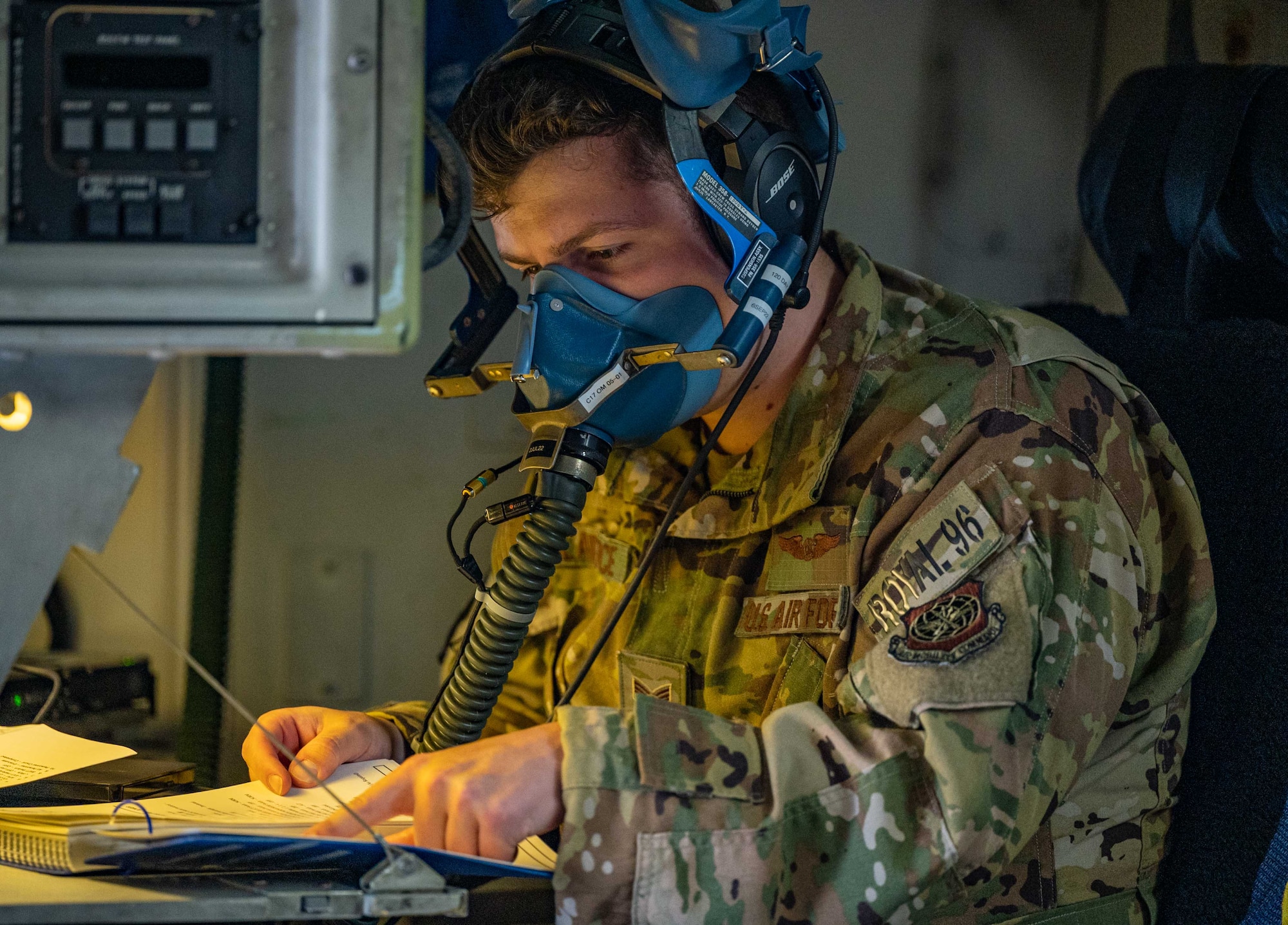 Staff Sgt. Daniel Lawrence, 3rd Airlift Squadron loadmaster, tests an oxygen mask before a local training mission aboard a C-17 Globemaster III at Dover Air Force Base, Delaware, June 15, 2022. The 3rd AS trains regularly to provide global reach with unique, outsized airlift capability. (U.S. Air Force photo by Senior Airman Faith Schaefer)