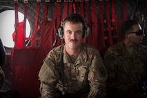 1 Soldier posing for a photo in an aircraft