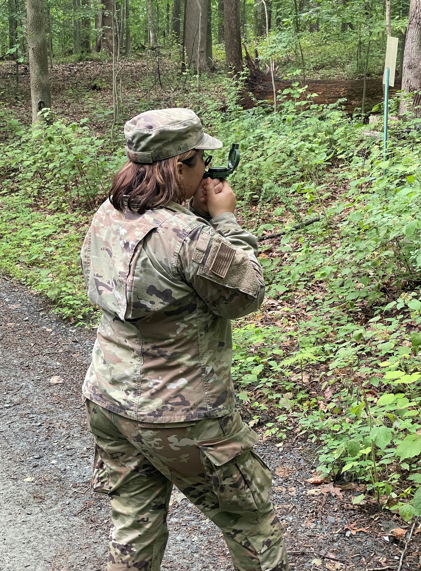 U.S. Air Force Senior Airman Alicia Buhr, a structures journeyman assigned to the 175th Civil Engineer Squadron, Maryland Air National Guard, participates in land navigation training at the Blum Military Reservation, Glen Arm, Maryland, June 24, 2022.