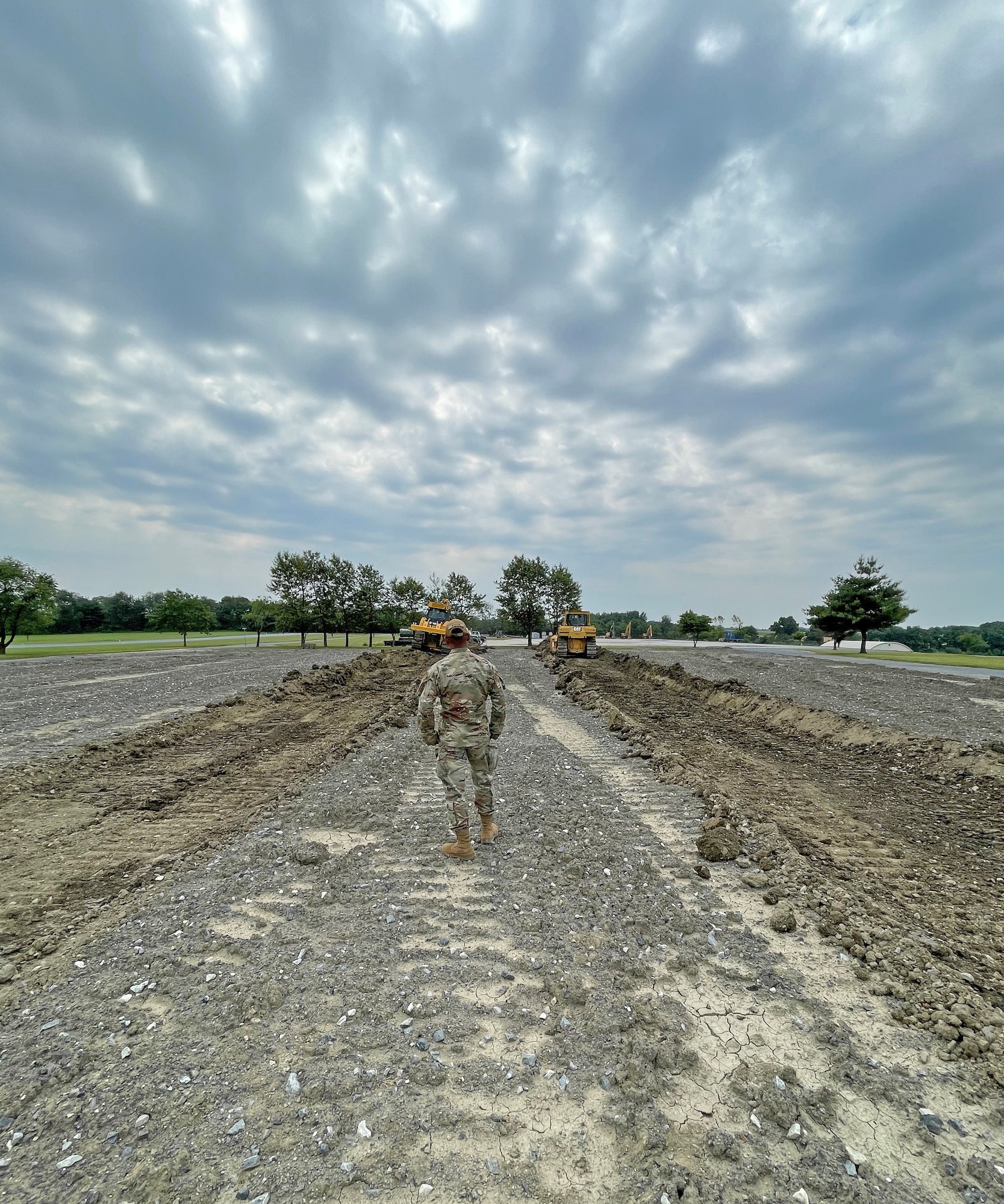 U.S. Air Force Tech. Sgt. Brandon Askew, a heavy equipment journeyman assigned to the 175th Civil Engineer Squadron, Maryland Air National Guard, observes 175th Wing Airmen training on heavy equipment at Ft. Indiantown Gap, Pennsylvania, June 22, 2022.