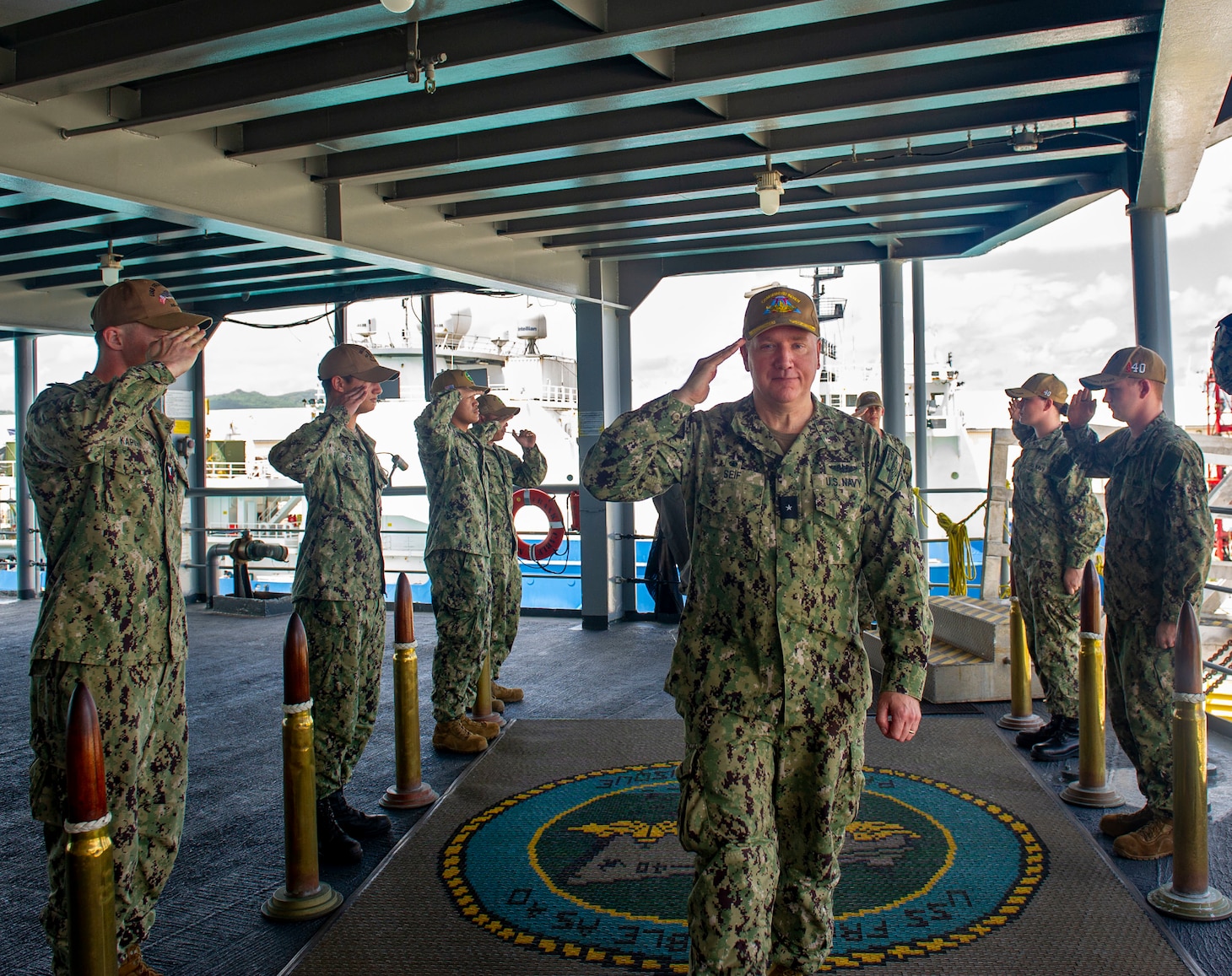 Rear Adm. Rick Seif, Commander, Submarine Group 7, is piped aboard the Emory S. Land-class submarine tender USS Frank Cable (AS 40) during a visit to the ship, June 10, 2022. Frank Cable, forward-deployed to the island of Guam, repairs, rearms, and re-provisions submarines and surface vessels in the Indo-Pacific region. (U.S. Navy photo by Mass Communication Specialist Seaman Wendy Arauz/Released)