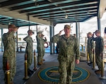 Rear Adm. Rick Seif, Commander, Submarine Group 7, is piped aboard the Emory S. Land-class submarine tender USS Frank Cable (AS 40) during a visit to the ship, June 10, 2022. Frank Cable, forward-deployed to the island of Guam, repairs, rearms, and re-provisions submarines and surface vessels in the Indo-Pacific region. (U.S. Navy photo by Mass Communication Specialist Seaman Wendy Arauz/Released)