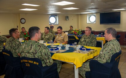 APRA HARBOR, Guam (June 10, 2022) Rear Adm. Rick Seif, Commander, Submarine Group 7 and regional triads meet for lunch aboard the Emory S. Land-class submarine tender USS Frank Cable (AS 40), June 10, 2022. Frank Cable, forward-deployed to the island of Guam, repairs, rearms, and re-provisions submarines and surface vessels in the Indo-Pacific region. (U.S. Navy photo by Mass Communication Specialist Seaman Wendy Arauz/Released)