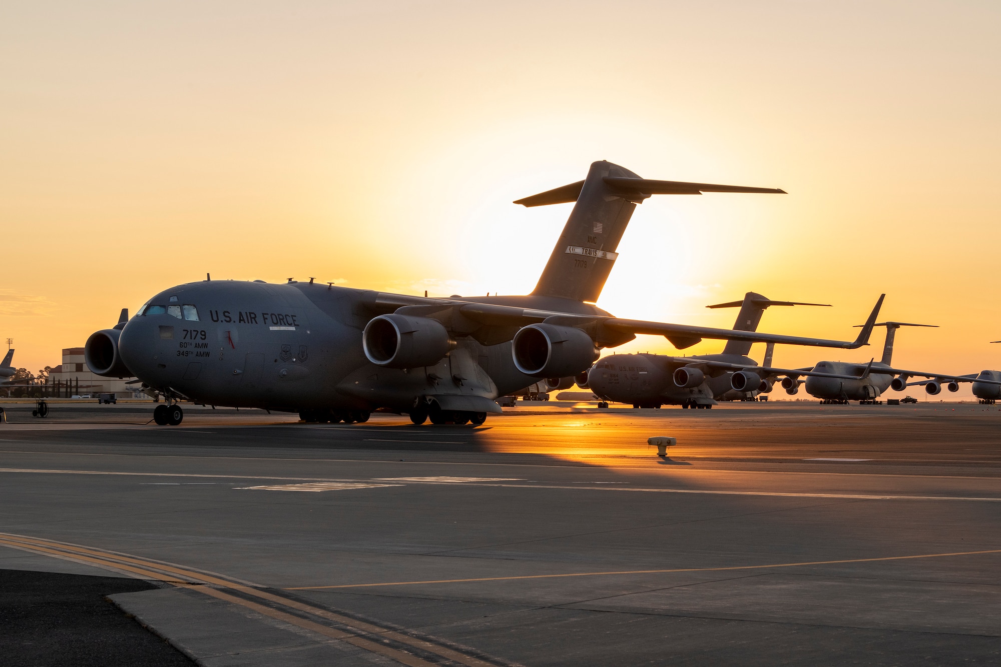 A C-17 Globemaster III is parked on the flight line during sunrise July 28, 2021, at Travis Air Force Base, California.