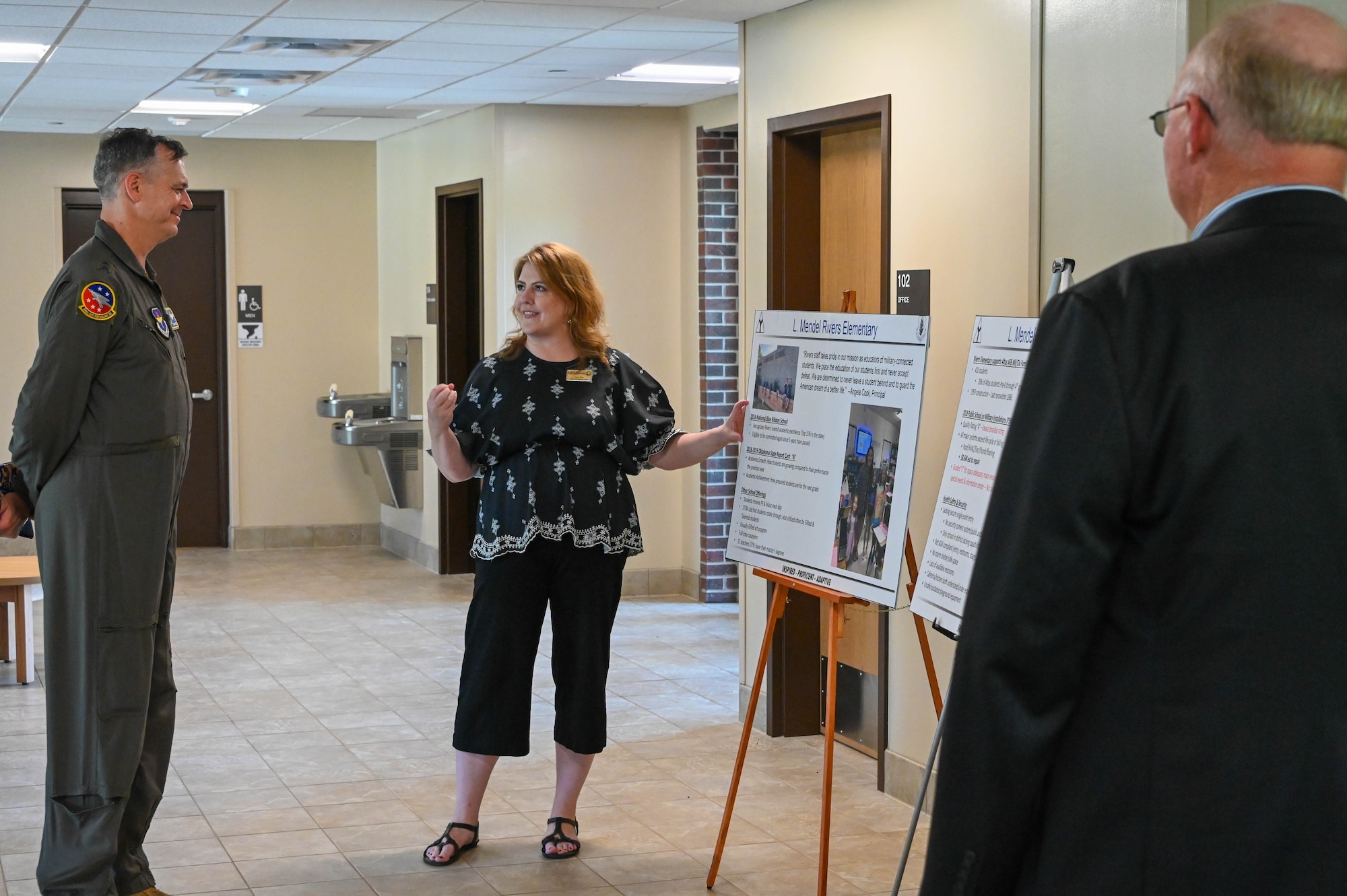 U.S. Air Force Maj. Gen. Craig D. Wills, 19th Air Force commander, listens to Judy Mott, 97th Air Mobility Wing school liaison, talk about Rivers Elementary School at Altus Air Force Base, Oklahoma, June 23, 2022. Mott discussed the improvements made at the new facility along with current statistics. (U.S. Air Force photo by Senior Airman Kayla Christenson)