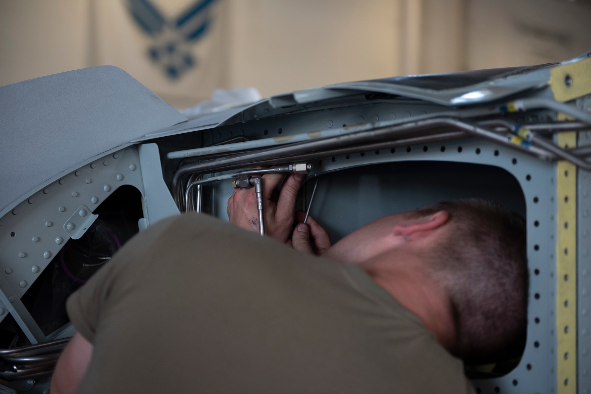 U.S. Air Force Staff Sgt. Ethan Short, 309th Aircraft Maintenance Group DEPOT aircraft craftsman, repairs a nutplay on an A-10C Thunderbolt II wing at Moody Air Force Base, Georgia, June 10, 2022. The 309th AMXG arrived from Hill Air Force Base, Utah, to remove and replace the wings on an A-10C. (U.S. Air Force photo by Airman 1st Class Rachel Coates)