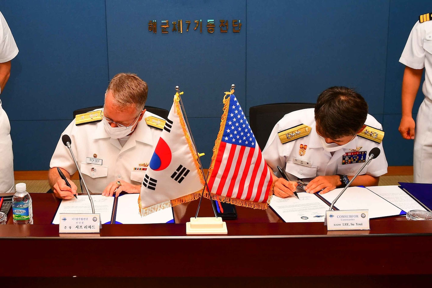 JEJU, Republic of Korea (June 22, 2022) Rear Adm. Rick Seif, Commander, Submarine Group 7, left, signs a memorandum with Rear Adm. Lee Su Youl, Commander, Republic of Korea (ROK) Navy Submarine Force, at the conclusion of the 54th semiannual Submarine Warfare Committee Meeting (SWCM) in Jeju, South Korea, June 22, 2022. Over the past 28 years, SWCM has brought together leaders of both the U.S. and ROK submarine forces to discuss combined submarine training and force integration. (Photo courtesy of ROK Public Affairs)