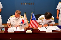 JEJU, Republic of Korea (June 22, 2022) Rear Adm. Rick Seif, Commander, Submarine Group 7, left, signs a memorandum with Rear Adm. Lee Su Youl, Commander, Republic of Korea (ROK) Navy Submarine Force, at the conclusion of the 54th semiannual Submarine Warfare Committee Meeting (SWCM) in Jeju, South Korea, June 22, 2022. Over the past 28 years, SWCM has brought together leaders of both the U.S. and ROK submarine forces to discuss combined submarine training and force integration. (Photo courtesy of ROK Public Affairs)