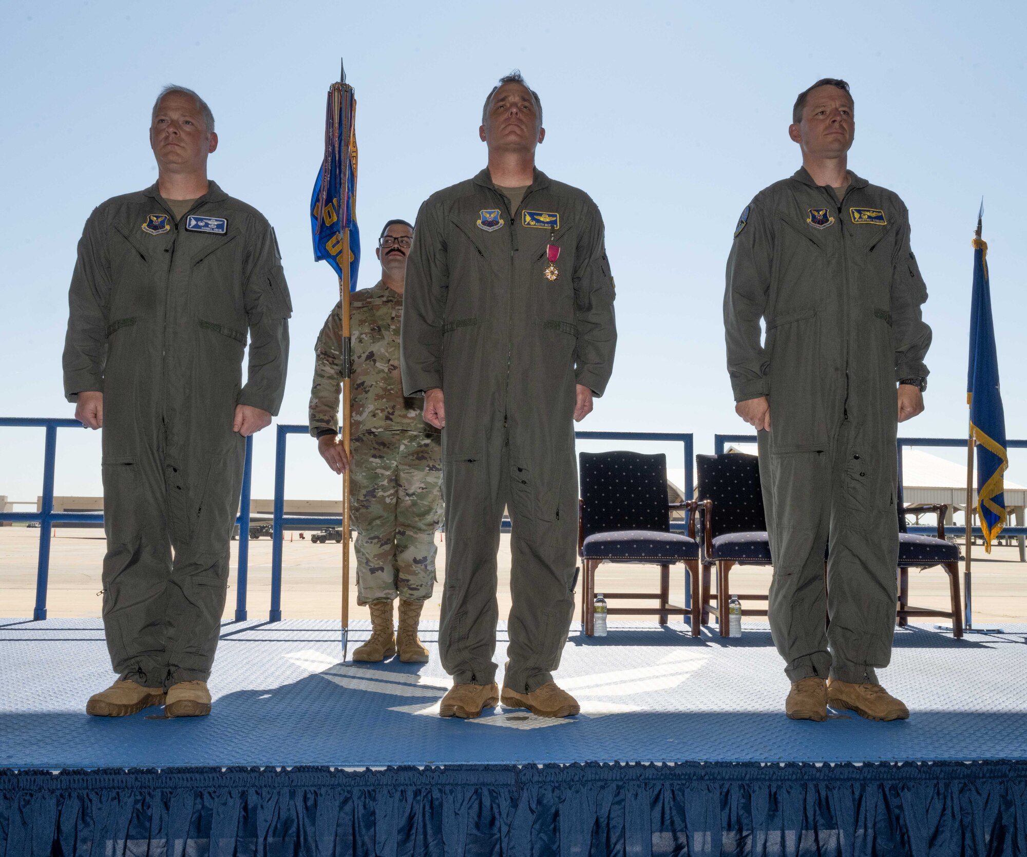 U.S. Air Force Col. Daniel Diehl, 509th Bomb Wing commander, presents U.S. Air Force Col. Geoffrey Steeves, 509th Operations Group commander, with the Legion of Merit Medal during the 509th OG change of command ceremony on Whiteman Air Force Base, Missouri, June 29, 2022. Holland received the medal for his contributions to Team Whiteman and the 509th OG during his command. (U.S. Air Force photo by Airman 1st Class Bryson Britt)