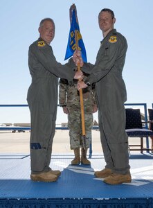 U.S. Air Force Col. Geoffrey Steeves assumes command of the 509th Operations Group and receives the ceremonial guidon from U.S. Air Force Col. Daniel Diehl, 509th Bomb Wing commander, at Whiteman Air Force Base, Missouri, June 29, 2022. The 509th OG is the flying component of the 509th Bomb Wing and is equipped with all 20 of the Air Force’s B-2 Spirit stealth bombers. (U.S. Air Force photo by Airman 1st Class Bryson Britt)