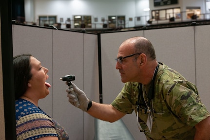 Lt. Col. Dan Tzizik of the New Hampshire Army National Guard Medical Detachment screens Tara Parker Dorler, a local daycare provider, during a Cherokee Nation Innovative Readiness Training exercise on June 5, 2022, in Tahlequah, Oklahoma.