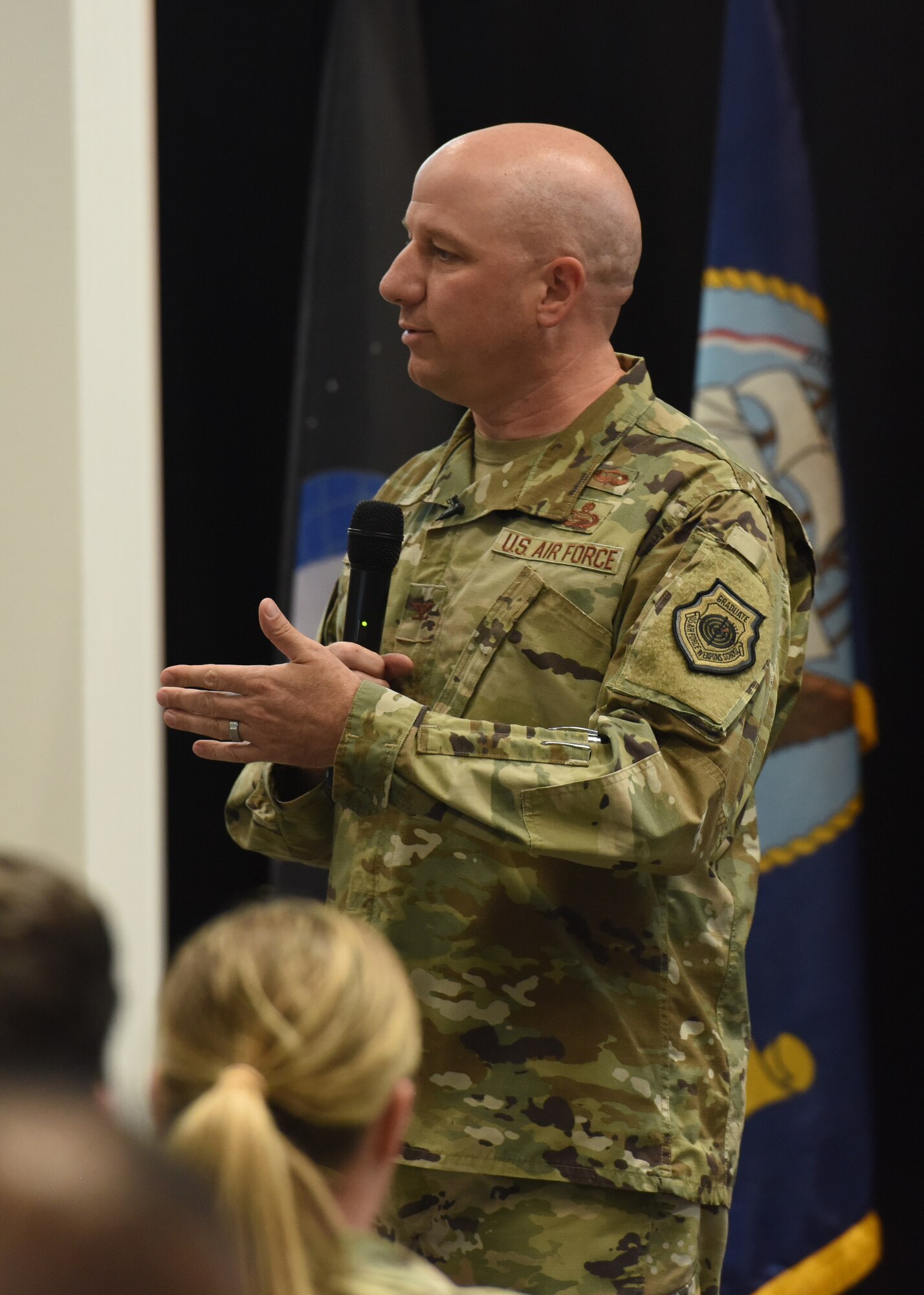 U.S. Air Force Col. Matthew Reilman, 17th Training Wing commander, speaks during the Commander’s Call at Goodfellow Air Force Base, Texas, June 27, 2022. Reilman restated his focus on mental health and resiliency. (U.S. Air Force photo by Airman 1st Class Zachary Heimbuch)